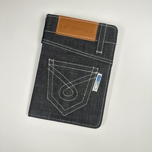 Are there any disadvantages to using denim fabric for customized notebook covers?